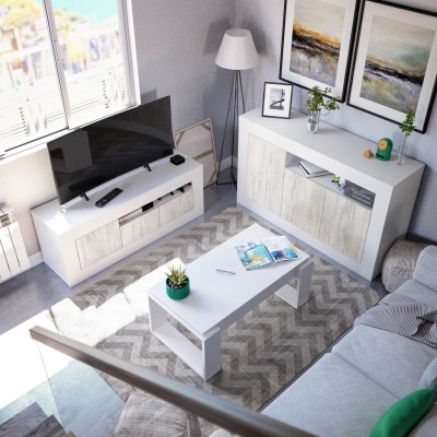 Sala de estar moderna com móveis brancos, tapete cinza zig-zag, sofá cinza, e decoração com quadros e plantas.