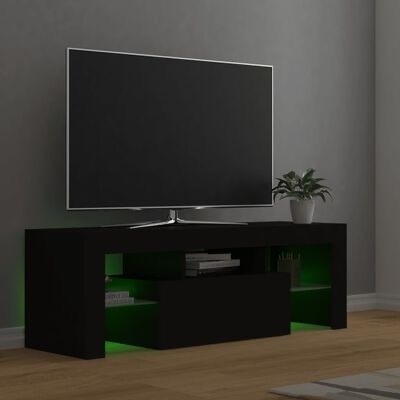 Móvel preto para TV com luzes LED verdes, tv grande, planta em vaso branco, livros, chão de madeira clara, parede cinza