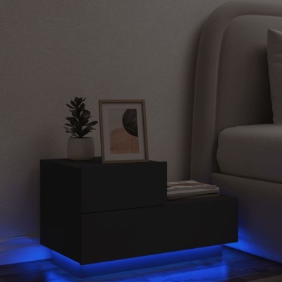 Mesa de cabeceira preta com luz LED azul ao lado de cama cinzenta