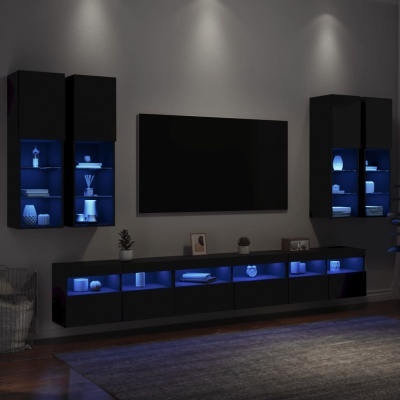 Conjunto de mobília preto com iluminação azul LED e TV numa sala moderna
