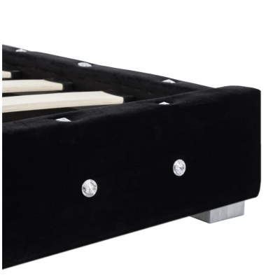 Estrutura de cama preta com botões brilhantes e pés metálicos