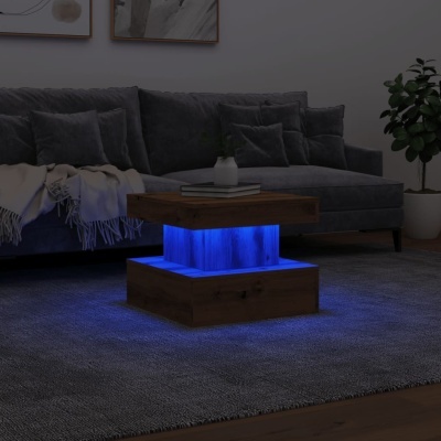 mesa de centro com iluminação LED azul em sala moderna com sofá cinzento