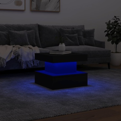 Mesa de centro preta com luz azul em sala com sofá cinza e tapete cinza