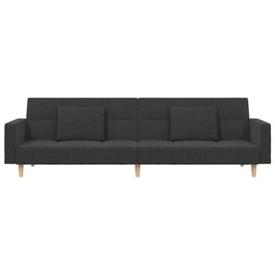 Sofá modular cinzento escuro com almofadas e pés de madeira