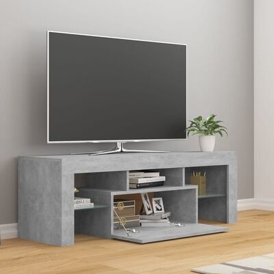 Móvel de televisão cinzento com televisão e planta num ambiente interior moderno