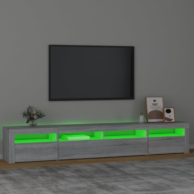 Móvel de TV cinza com iluminação verde e decoração em sala