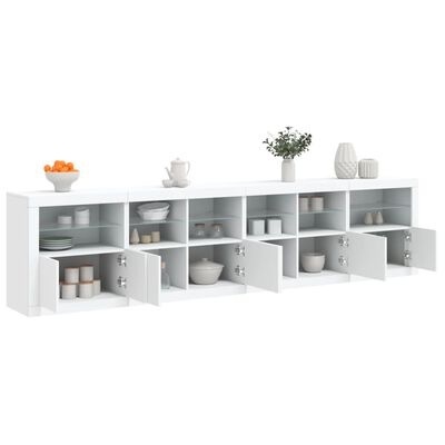 Móvel de armazenamento branco com pratos, tigelas, frascos e objetos decorativos