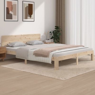Cama de madeira clara com roupa de cama cinzenta e rosa e decoração moderna
