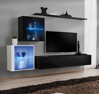 Móvel de parede moderno com iluminação LED azul, televisão e decoração numa sala de estar.