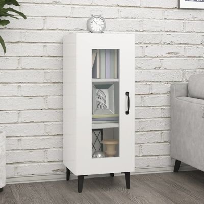 Móvel branco com porta de vidro em sala de estar, contendo livros e objetos decorativos