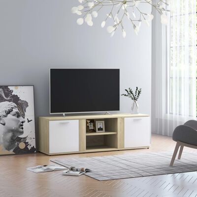 Móvel TV madeira clara com portas brancas, TV preta, jarra com ramo verde, tapete cinzento e quadro de escultura