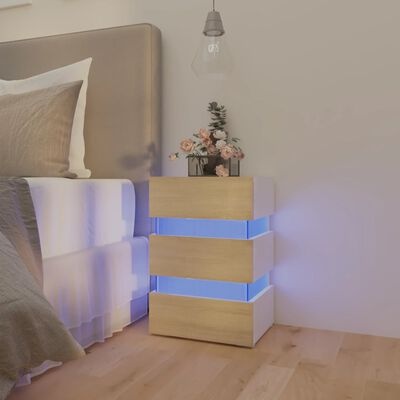 Mesa-de-cabeceira moderna com iluminação azul ao lado de cama num quarto minimalista