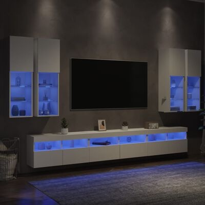 Móveis modernos de sala brancos com iluminação azul e televisão montada na parede