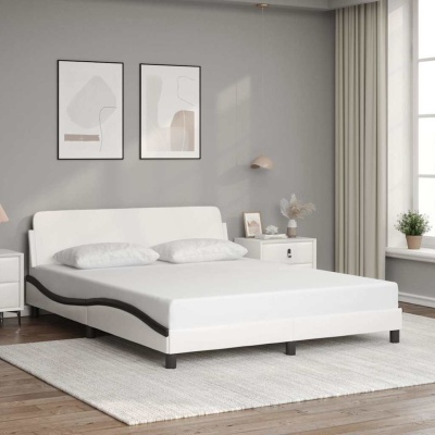 Cama branca moderna com duas almofadas num quarto minimalista cinzento