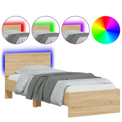 Cama individual de madeira clara com iluminação LED colorida na cabeceira, roupa de cama cinza e branco