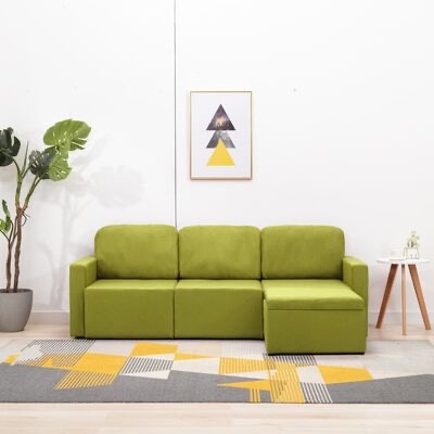 Sofá modular verde com chaise longue numa sala moderna