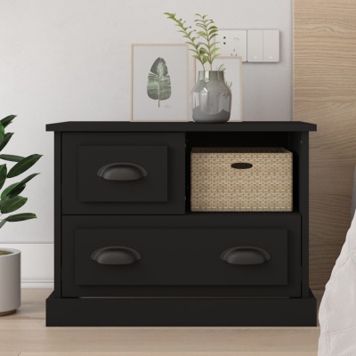 Móvel preto com gavetões e cesta de ráfia, planta e decoração no topo, ao lado de cama
