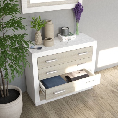 Cómoda branca e bege com gavetas e decoração em vaso e livros