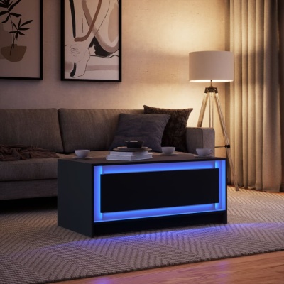 Mesa de centro preta com luz LED azul numa sala com sofá cinza e luminária de pé