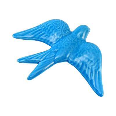 Figura decorativa azul em forma de andorinha em cerâmica