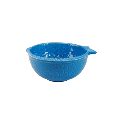 Tigela azul de cerâmica com padrão de escamas e bico para verter