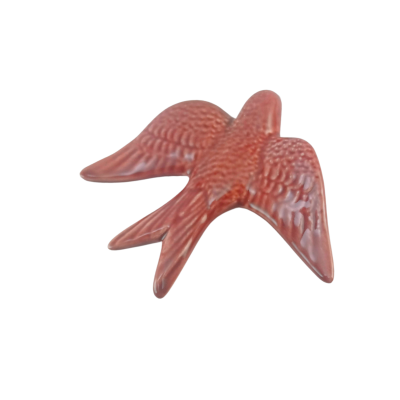 Passaro decorativo de cerâmica castanho-avermelhado com asas abertas