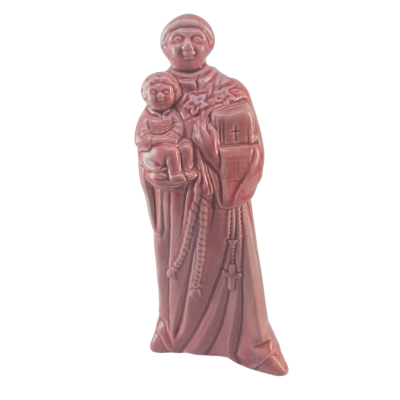 Estatueta cor-de-rosa de santo com criança ao colo e livro
