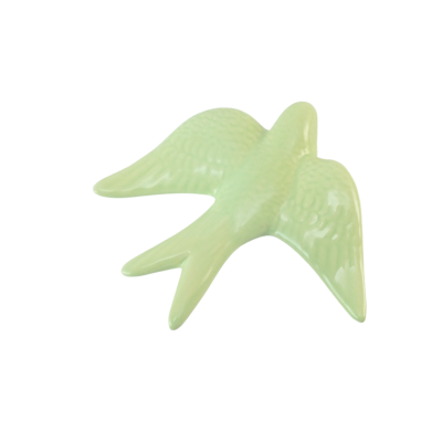 Decorative ceramic bird figure in pale green with feather texture and glossy finish
