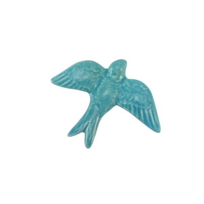 Figura decorativa azul em forma de pássaro