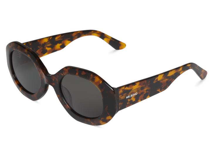 Óculos de sol com armação padrão tartaruga e lentes escuras