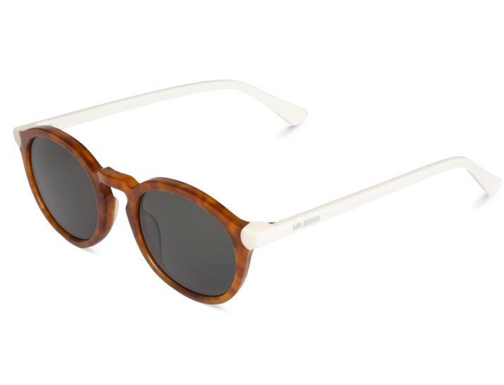 Óculos de sol redondos com armação castanha tartaruga e hastes brancas
