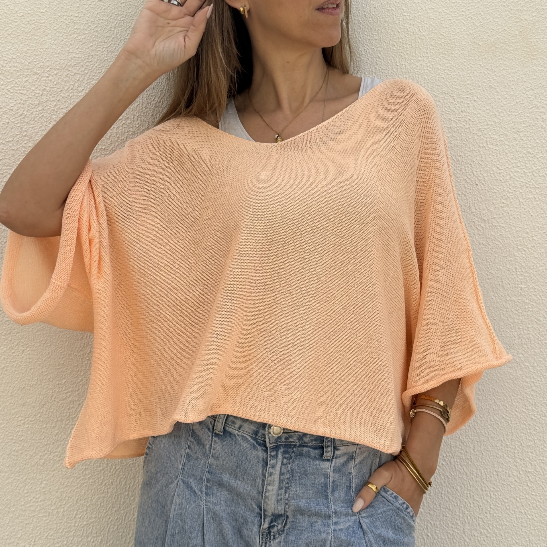 Top feminino malha leve pêssego com mangas largas