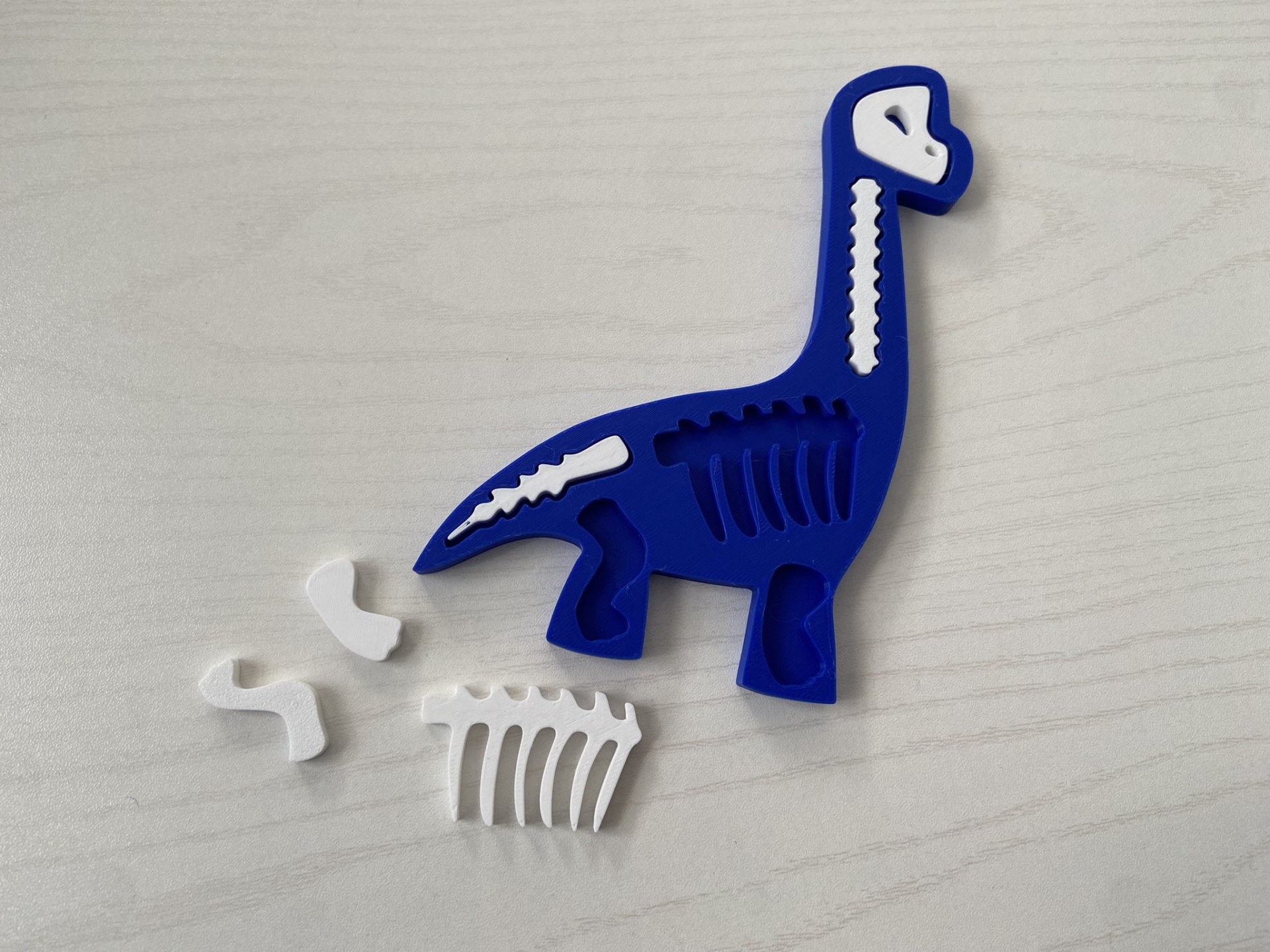 Puzzle # Dinossauros # Kit 2 Forma de silicone azul em formato de dinossauro com partes brancas removíveis