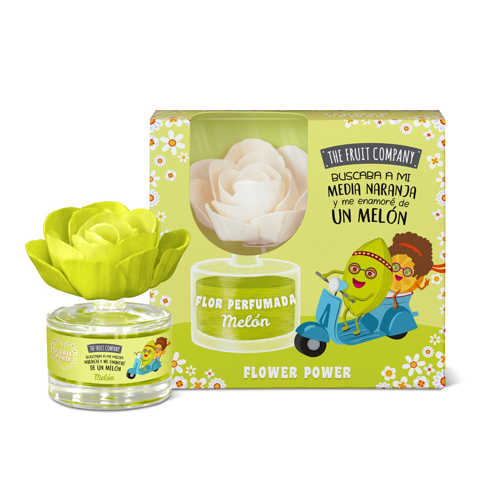 Frasco de vidro com flor perfumada verde e caixa amarela e verde com ilustração e texto em espanhol e inglês