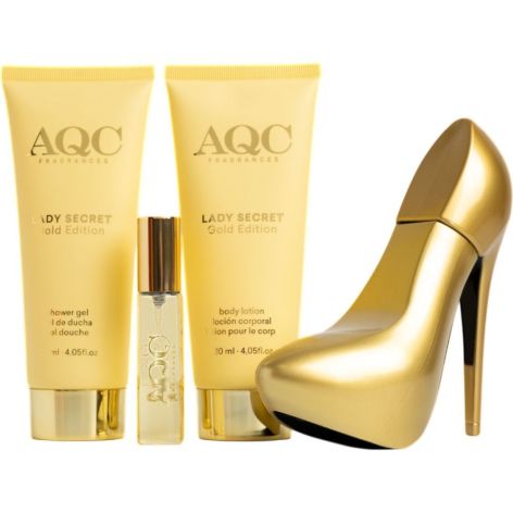 Conjunto AQC Lady Secret Gold Edition com gel de banho, loção, fragrância em frascos dourados ao lado de estojo em forma de sapato dourado.