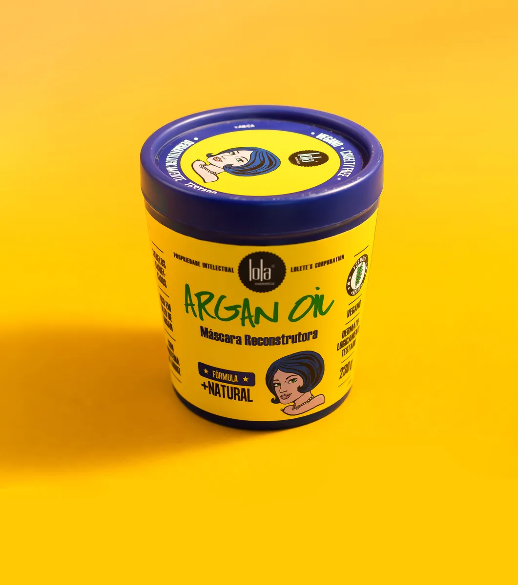 Recipiente amarelo com tampa azul de máscara reconstrutora para cabelo Argan Oil