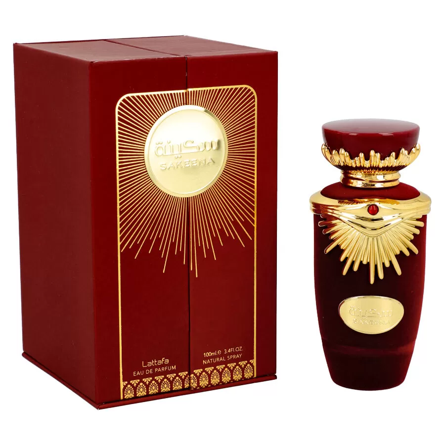 Frasco e caixa de perfume vermelho escuro com detalhes dourados e texto Ajwaa