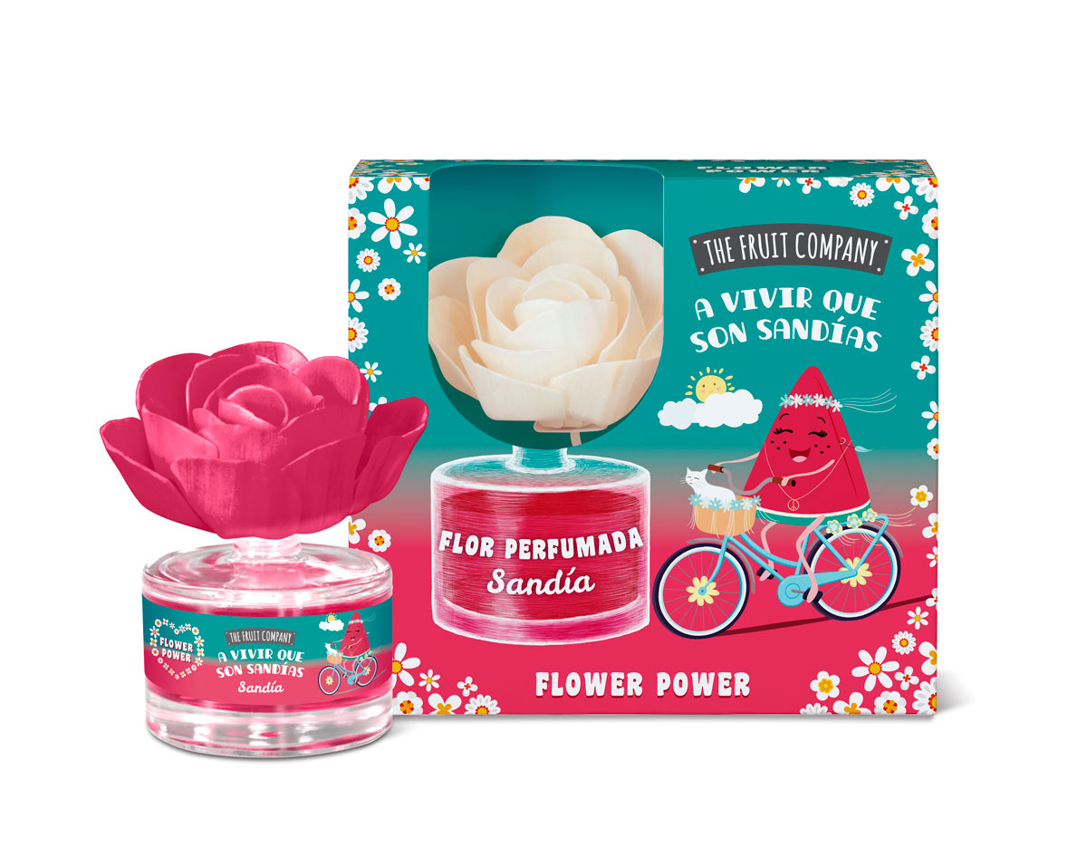 Perfume em frasco com flor em tecido rosa e embalagem colorida com melancia a andar de bicicleta