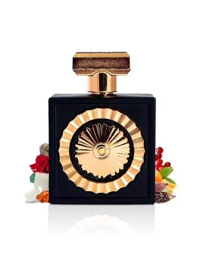 Frasco preto de perfume com detalhes dourados e elementos naturais ao fundo