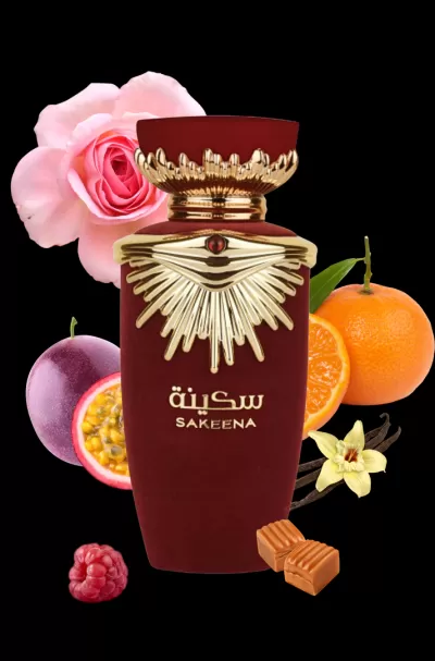 Frasco de perfume vermelho e dourado com flores, frutos e caramelos ao redor