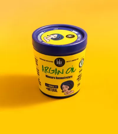 Recipiente amarelo com tampa azul de máscara reconstrutora para cabelo Argan Oil