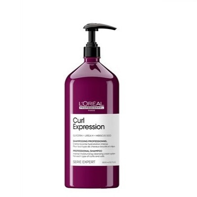 Frasco de shampoo roxo L'Oreal Curl Expression com doseador preto e rótulo branco.
