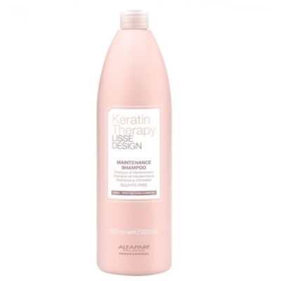 Frasco rosa claro de champô Keratin Therapy com tampa branca e texto detalhado no rótulo