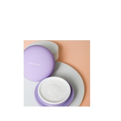 Creme facial em embalagem roxa com tampa e prato branco