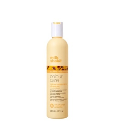 Frasco plástico amarelo com tampa branca de shampoo milk shake colour care