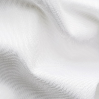 Tecido branco com textura de pequenos quadrados ondulado