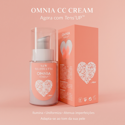 Creme Omnia CC Cream em embalagem pump e caixa cor de pêssego com coração branco e texto, fundo rosa.