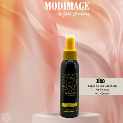 Frasco de loção para cabelo preto e amarelo da MODIMAGE num fundo de tecido rosa