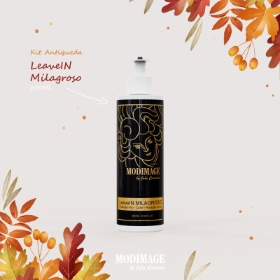 Frasco de leave-in Milagroso da marca Modimage, decorado com motivos dourados e fundo preto, rodeado por folhas de outono coloridas