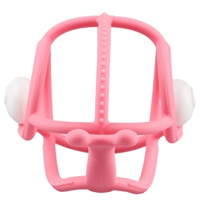 Estrutura cor-de-rosa de plástico com duas bolinhas brancas nas extremidades